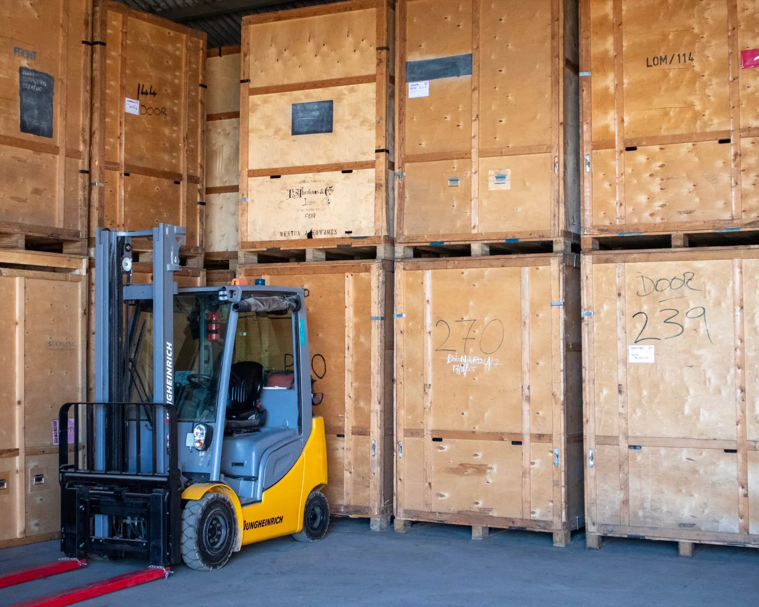 Acorn's containerised storage facility in Newbury, forklift and crates inside